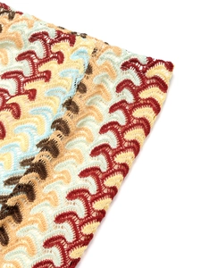Macro detail of multi-color wavy crochet knit fabric for summer vacation set