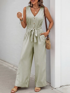 Detail of V-neck sleeveless striped jumpsuit with waist tie and wooden buttons