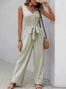 Detail of V-neck sleeveless striped jumpsuit with waist tie and button accents