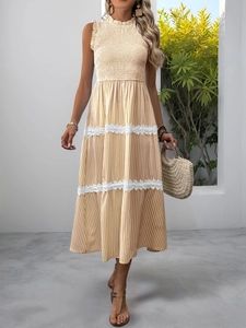 Detailed lace trim and vertical striped fabric on an elasticated sleeveless summer dress