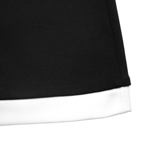 Detail shot of high-quality black and white contrast stitching on summer midi skirt