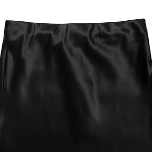 Close-up of black satin fishtail skirt waist featuring smooth high-gloss silk texture