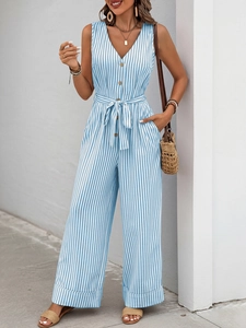 Detail of blue and white striped sleeveless jumpsuit with v-neck and waist tie belt