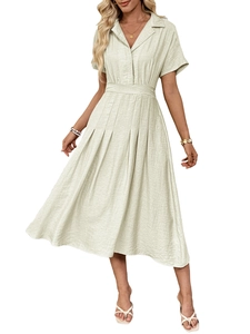 Detail of short sleeve shirt dress in light beige fabric with textured pleated skirt