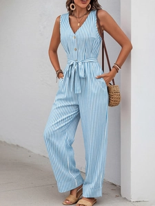 Detail of V-neck striped jumpsuit featuring wooden buttons and adjustable waist tie
