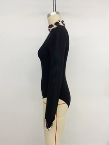Detail of rib-knit texture and leopard print trim on this black long sleeve bodysuit