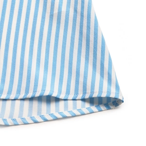 Close-up of high-quality blue and white striped fabric hem with neat stitching detail