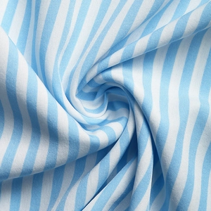 Close-up of blue and white striped fabric showing fine lace texture and soft material