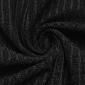 Close-up of black ribbed knit fabric texture showing vertical stripes and soft drape