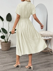 Detail of waist design and wrinkled fabric on a short-sleeved casual midi dress