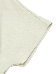 Detailed close-up of beige linen shirt dress cuff with high-quality stitching