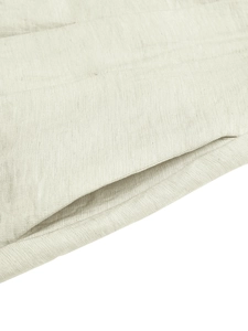Detail of side pocket on beige linen-cotton dress showing natural fabric texture