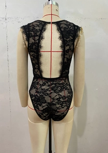 Detail of black eyelash lace bodysuit featuring an open back design on a mannequin