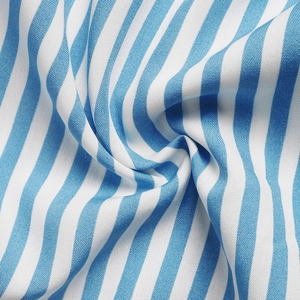 Macro shot of blue and white striped cotton fabric showing soft texture and weave detail