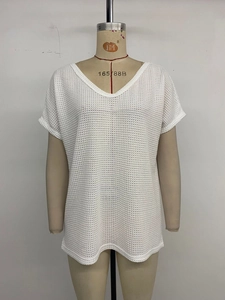 Detail of white V-neck short sleeve tee with mesh knit texture on a mannequin
