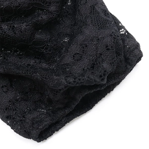 Macro detail of intricate black floral lace pattern and mesh texture on bodysuit sleeve