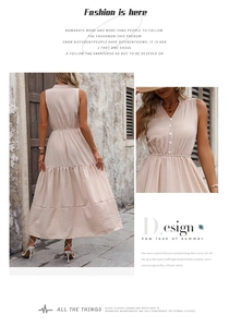 Detail of light pink sleeveless V-neck dress with button front and tiered maxi skirt