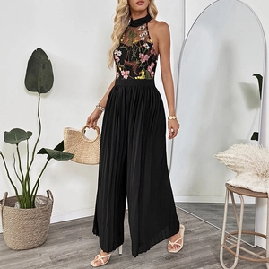 Women black halter neck lace jumpsuit with floral embroidery and pleated wide leg trousers