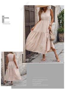 Detail of beige sleeveless dress featuring V-neck buttons and textured fabric