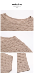 Gros plan du haut beige pour femme montrant la texture 3D et les détails de l'encolure