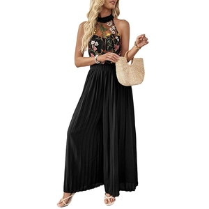 Black sleeveless halter neck jumpsuit with floral embroidery and pleated wide leg design