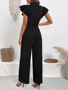Detail view of black high waist jumpsuit with ruffled butterfly sleeves and wide leg design