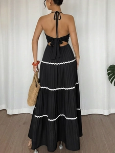 Elegant backless halter maxi dress with white wavy stripes and black bow details