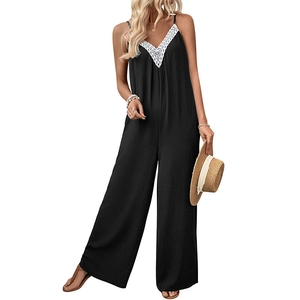 Combinaison pantalon noire sans manches avec dentelle blanche et jambes larges