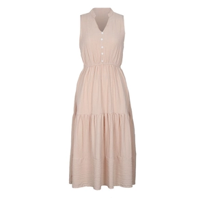 Detail of V-neck sleeveless tiered dress with crinkle texture and white button accents