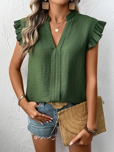 Detail of dark green V-neck chiffon top with ruffled butterfly sleeves and fabric texture