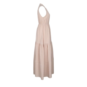 Detail of light pink tiered sleeveless maxi dress showing textured fabric and elastic waist