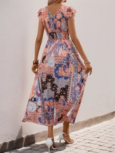 Detailed back view of a paisley print maxi dress with elastic waist and backless design