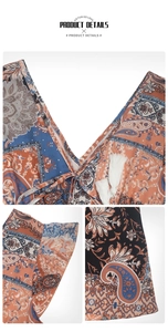 Detail of V-neckline with paisley floral print and white tassel ties on a boho midi dress