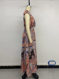 Detail of bohemian paisley print maxi dress showing ruffled sleeves and drawstring waist