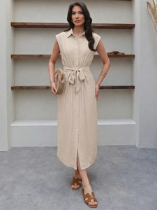 Detail of beige sleeveless shirt dress with waist tie and button-down front