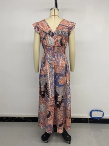 Detail view of back deep V-neck and paisley print on bohemian maxi dress