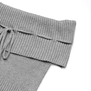 Detail of grey ribbed knit off-shoulder top featuring drawstring and folded hem design