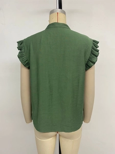 Back view of dark green sleeveless blouse with ruffle trim and stand collar detail