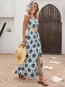 Detailed view of the V-neck bodice and woven belt on a boho print maxi dress