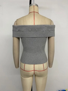 Detailed texture of grey rib-knit off-shoulder top with back pleat detailing
