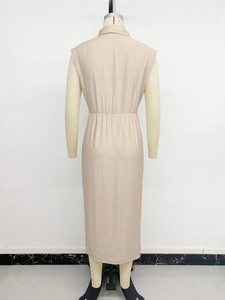 Back view of apricot sleeveless shirt dress with elastic waist and textured fabric