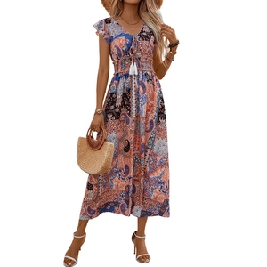 Bohemian paisley print maxi dress with V-neck and tassel drawstrings in vibrant orange and blue