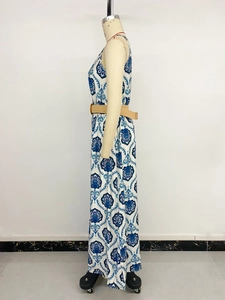 Detail view of ethnic floral print maxi dress with woven belt and side slit design