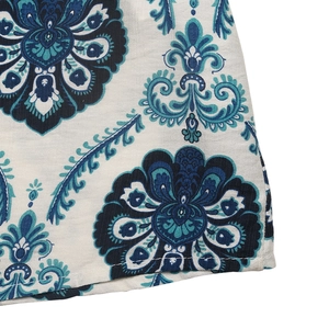 Close-up of mandala ethnic print on cotton linen hem with professional flat seam stitching