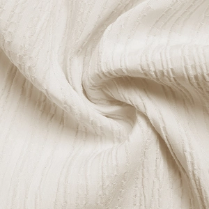 Detailed macro view of ivory summer dress fabric with vertical striped texture and soft drape
