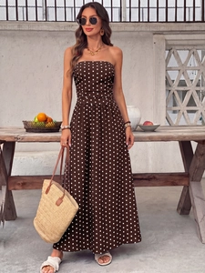 Detail of vintage polka dot strapless maxi dress with waist cinching and A-line skirt