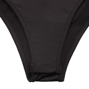 Detailed macro view of black bodysuit bottom with reinforced stitching and soft fabric