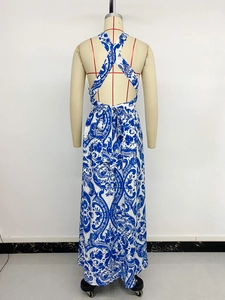 Detail of the cross back straps and waist tie on the blue and white floral maxi dress