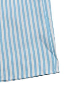 Close-up of blue and white vertical striped fabric with detailed hem stitching on romper