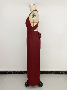 Detail view of the elegant deep red halter neck jumpsuit with an open back and high waist design